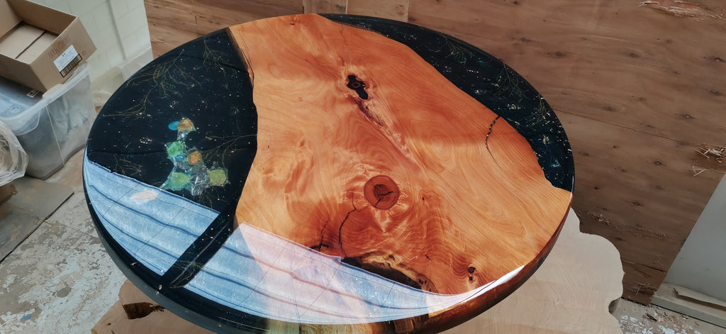 Large round epoxy table macrocarpa cosmic